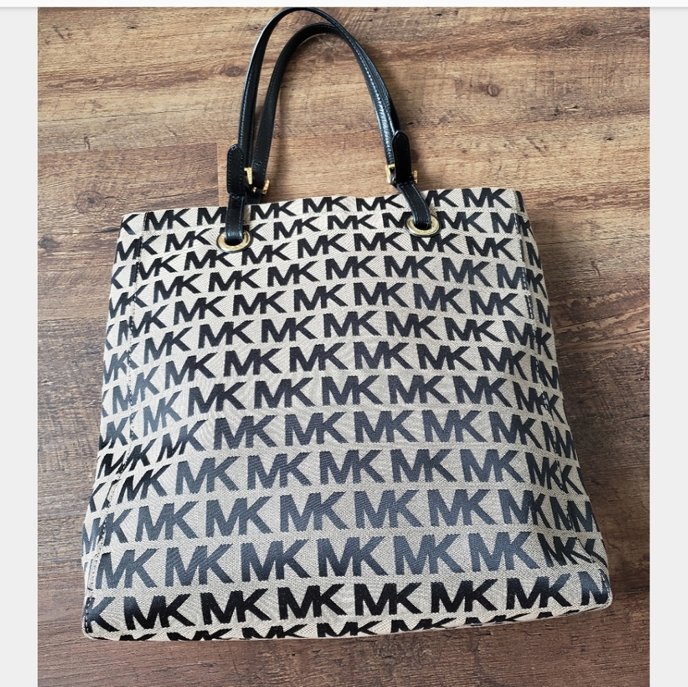 Tan/black MK logo. Canvas, silver, leather. Tote.